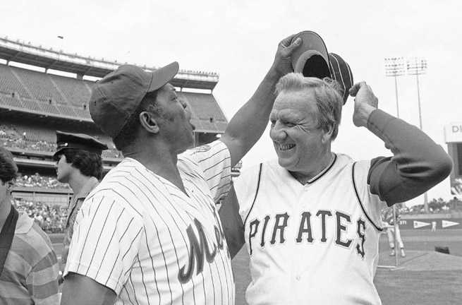 Baseball Hall of Fame slugger Ralph Kiner, right, (with Willie Mays) died at his home in California on Thursday. He was 91.